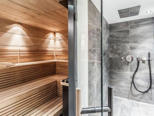 a bathroom with a sauna with a shower at Chalet Montafon-1 by Interhome in Gaschurn
