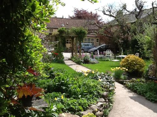 a garden in front of a house at Bramwood Cottages in Pickering
