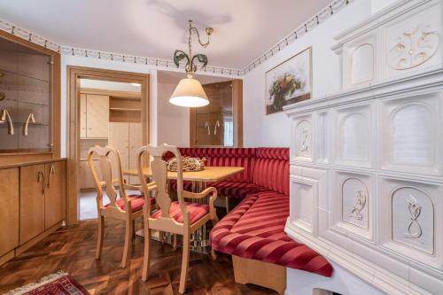 a dining room with a table and two chairs at Appartements Mair in Mayrhofen