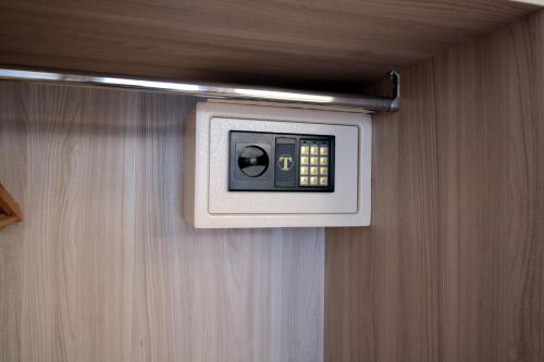a tv on the wall of a bathroom at Hotel Vittoria in Genova