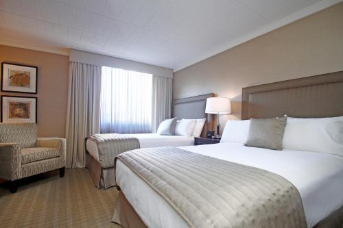 Katil atau katil-katil dalam bilik di Ethan Allen Hotel