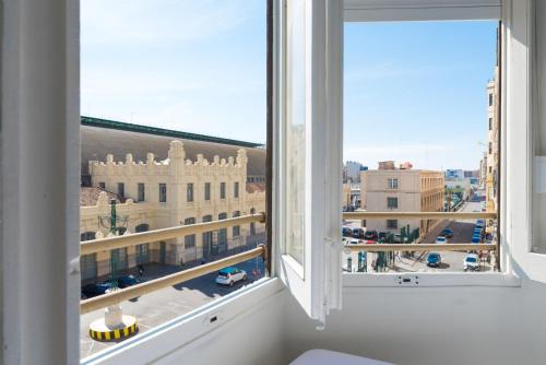 a room with a window and a large window at NWT Central Station Valencia in Valencia