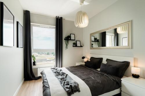 Voodi või voodid majutusasutuse Apartament 12 piętro z widokiem na Gdansk toas