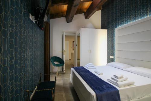 Giường trong phòng chung tại Nel Cuore dell'Aquila BnB