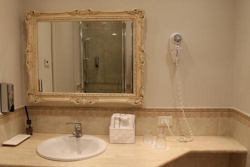 Ein Badezimmer in der Unterkunft Hotel Capovilla