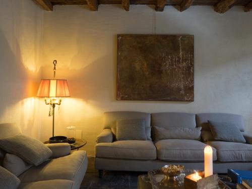 a living room with a couch and a table at Palazzo Albricci Peregrini in Como