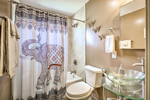 a bathroom with a shower curtain with an elephant on it at Contemporary NOLA Home - Walk to City Park! in New Orleans