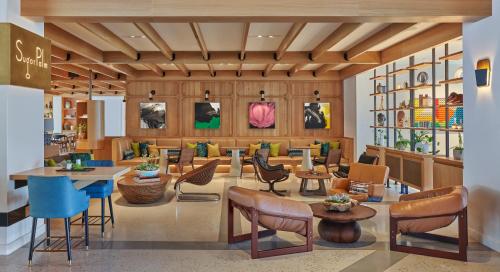 a lobby of a store with chairs and tables at Viceroy Santa Monica in Los Angeles