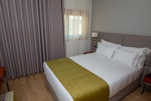 Postel nebo postele na pokoji v ubytování Hotel Fafense