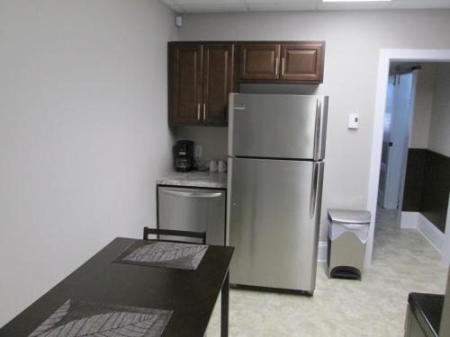 Kuchyň nebo kuchyňský kout v ubytování Executive Suites Bathurst