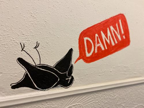 a painting of a bat on a wall at Hotel Credible in Nijmegen