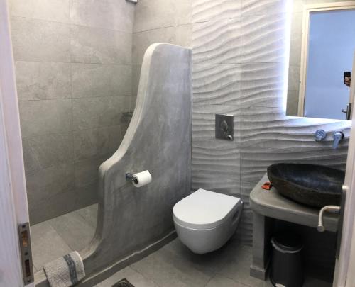 a bathroom with a sink and a toilet in it at Evagelia's Place in Agios Ioannis Mykonos