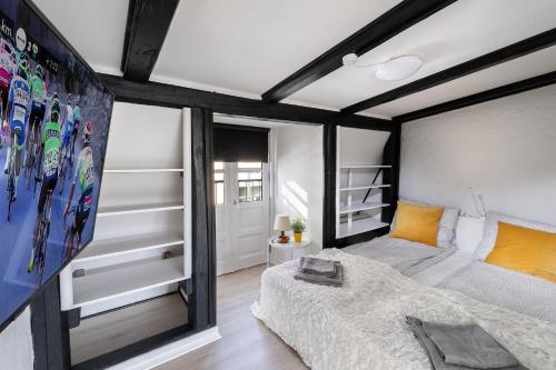 a bedroom with a bed and skis on the wall at aday - Apartment suite 4 Aalborg Center in Aalborg