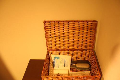 a wicker basket sitting on top of a table at Konaya Hotel in Kofu