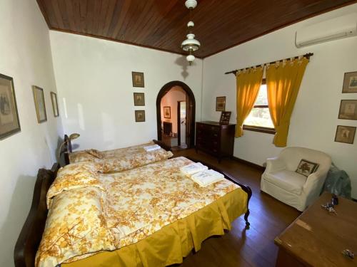 Llit o llits en una habitació de Pousada Fazenda Pinhalzinho