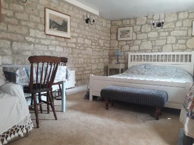 Un pat sau paturi într-o cameră la The Barn @ Hillside