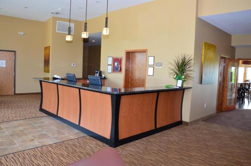 a lobby with a reception desk in a hospital at Cobblestone Inn & Suites - Newton in Newton