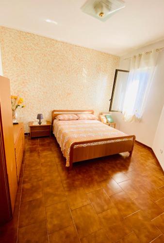 a bedroom with a bed in a room at B&B Marilyn's House in Gragnano