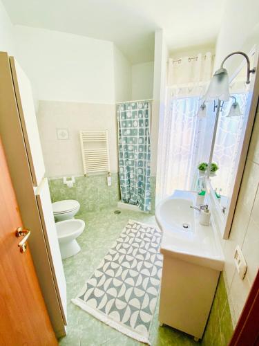 a bathroom with a sink and a toilet and a shower at B&B Marilyn's House in Gragnano