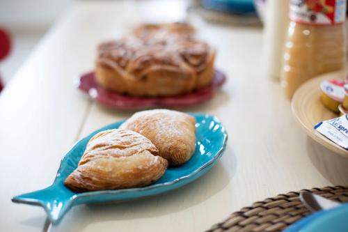 two pastries on a blue plate on a table at Raito Home costa d'Amalfi in Vietri sul Mare