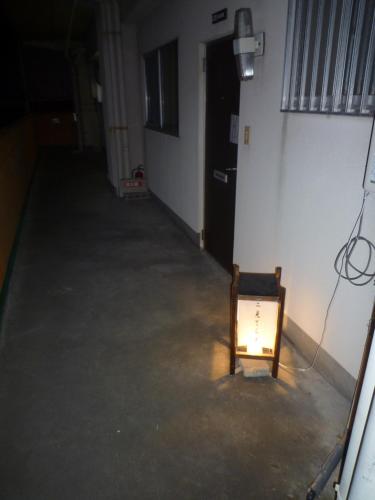 a room with a light on the side of a building at Futami Terrace C in Ise