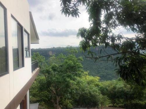 a view of the mountains from a house at CASA EL MIRADOR in Anapoima