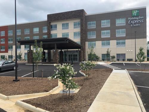 an office building with a parking lot in front of it at Holiday Inn Express & Suites - Roanoke – Civic Center in Roanoke