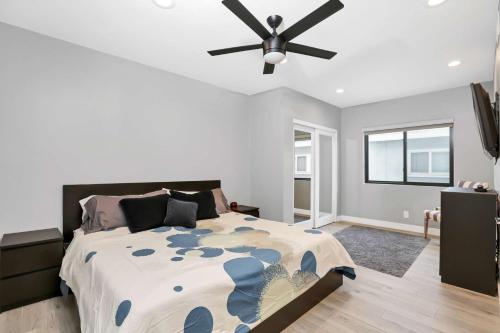 a bedroom with a bed and a ceiling fan at 308 35th Street, Unit A (Lower) in Newport Beach