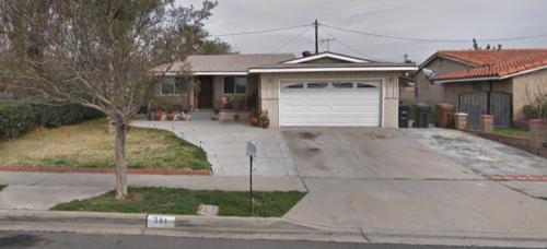 a house with a parking meter in front of a driveway at Home Sweet Home in Colton