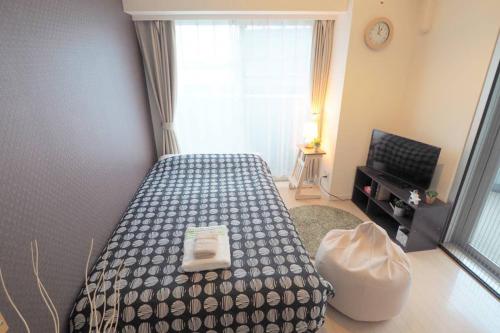 Кровать или кровати в номере 渋谷道玄坂401