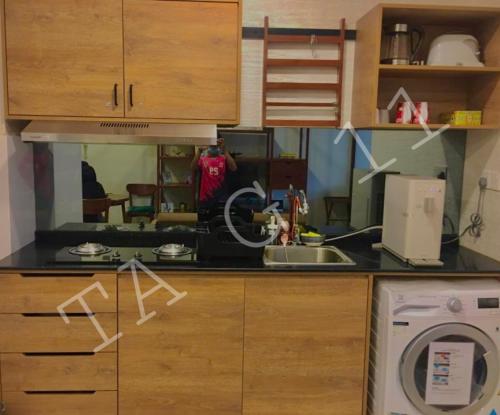 a kitchen with a sink and a washing machine at TA-G-11 @timurbay in Kuantan