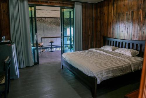 Postel nebo postele na pokoji v ubytování Lanna Homestay
