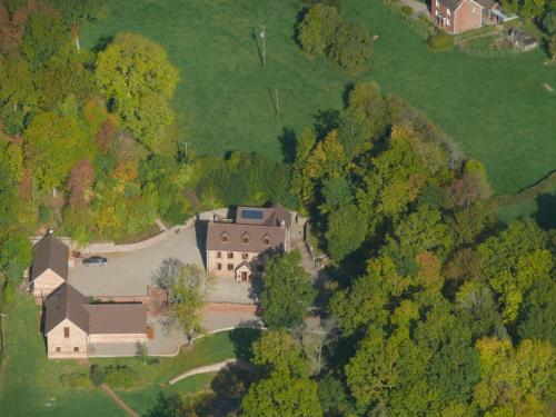an aerial view of a large house in the trees at The Motor House in Ledbury