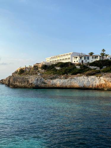a house on top of an island in the water at ICON Valparaiso - Adults Only in Cala Murada