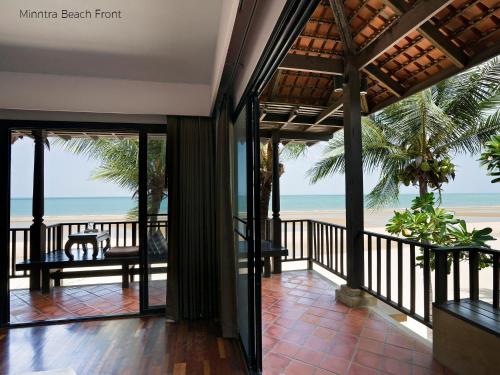 a view of the beach from the balcony of a resort at Praseban Resort in Pran Buri