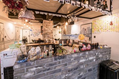a kitchen filled with lots of food and decorations at MAMA Guesthouse Haeundae in Busan