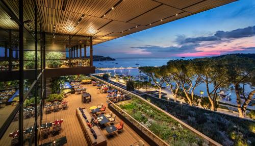 an overhead view of a restaurant with a view of the water at Grand Park Hotel Rovinj by Maistra Collection in Rovinj