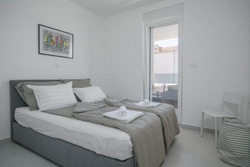 Krevet ili kreveti u jedinici u okviru objekta Apartment Figtree Vodice