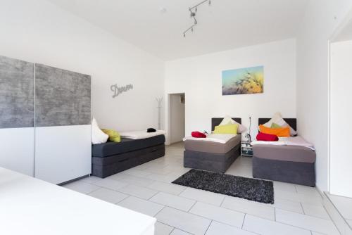 Postel nebo postele na pokoji v ubytování Oberkasseler Hof Bonn