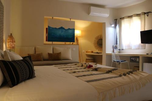 Postel nebo postele na pokoji v ubytování Movenpick Resort Lamantin Saly