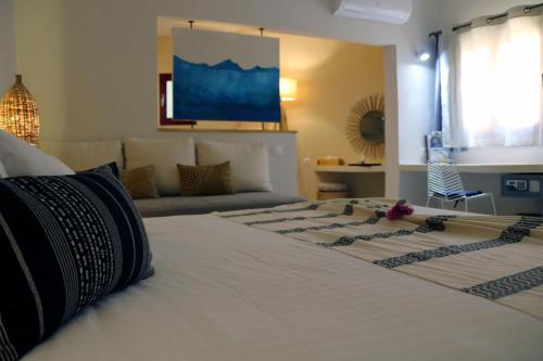 Postel nebo postele na pokoji v ubytování Movenpick Resort Lamantin Saly