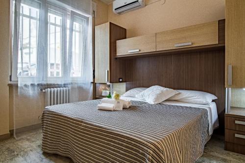 Locanda dell'Adriatica tesisinde bir odada yatak veya yataklar