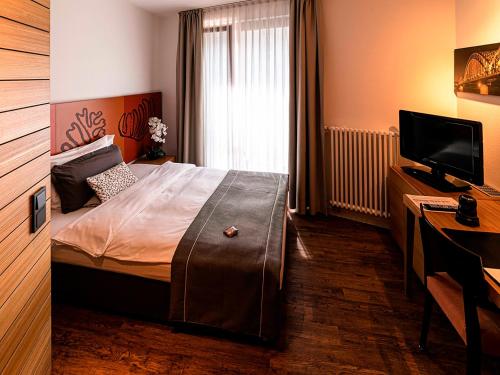 Säng eller sängar i ett rum på Hotel Begardenhof
