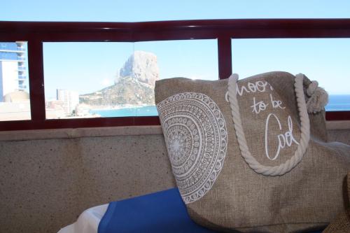a pillow in a room with a view of the mountain at Holiday apartment Amatista in Calpe