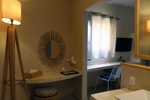 TV a/nebo společenská místnost v ubytování Movenpick Resort Lamantin Saly