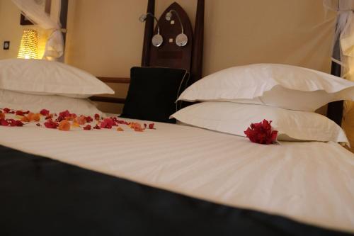 Postel nebo postele na pokoji v ubytování Movenpick Resort Lamantin Saly