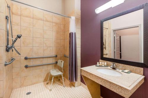 a bathroom with a sink and a shower at La Quinta by Wyndham Lumberton in Lumberton