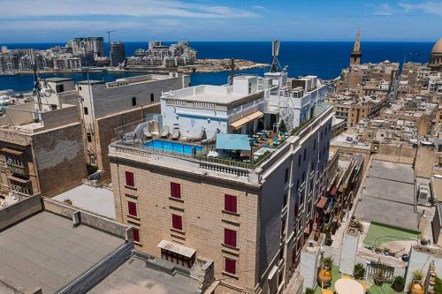 an aerial view of a city with the ocean at Osborne Hotel in Valletta