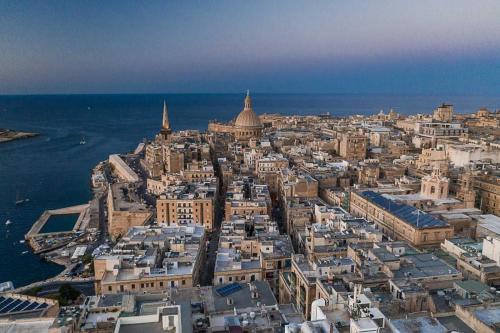 an aerial view of a city next to the ocean at Osborne Hotel in Valletta