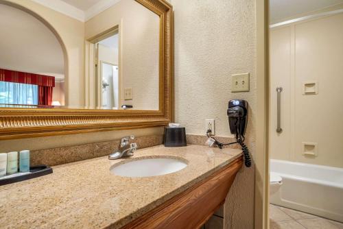 A bathroom at Clarion Inn Conference Center Gonzales